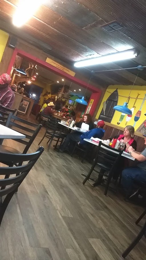 Family-friendly dining area with chairs and visible table settings.
