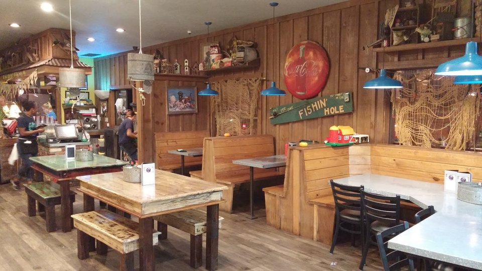 Restaurant interior with counter service and simple decor.