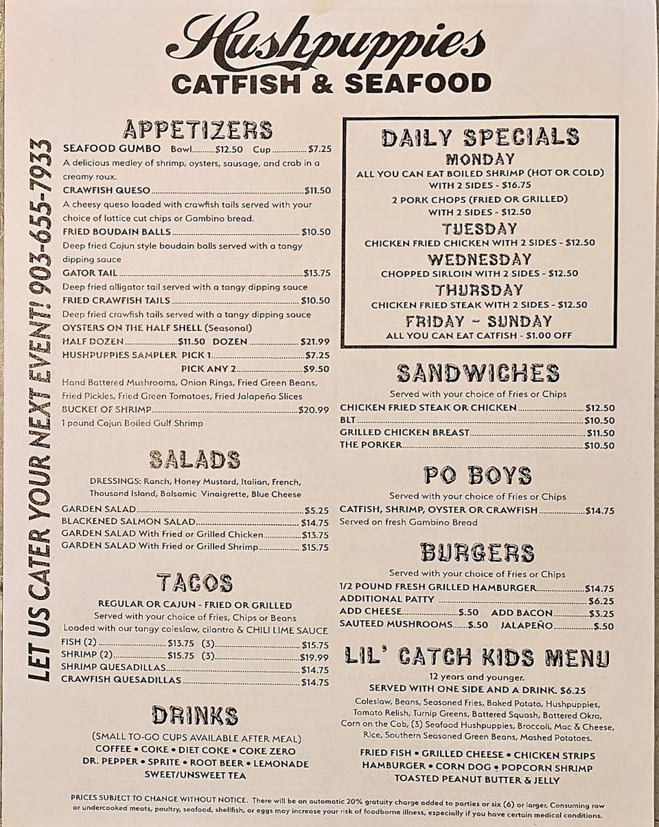 Menu board with seafood, sandwiches, and salads.