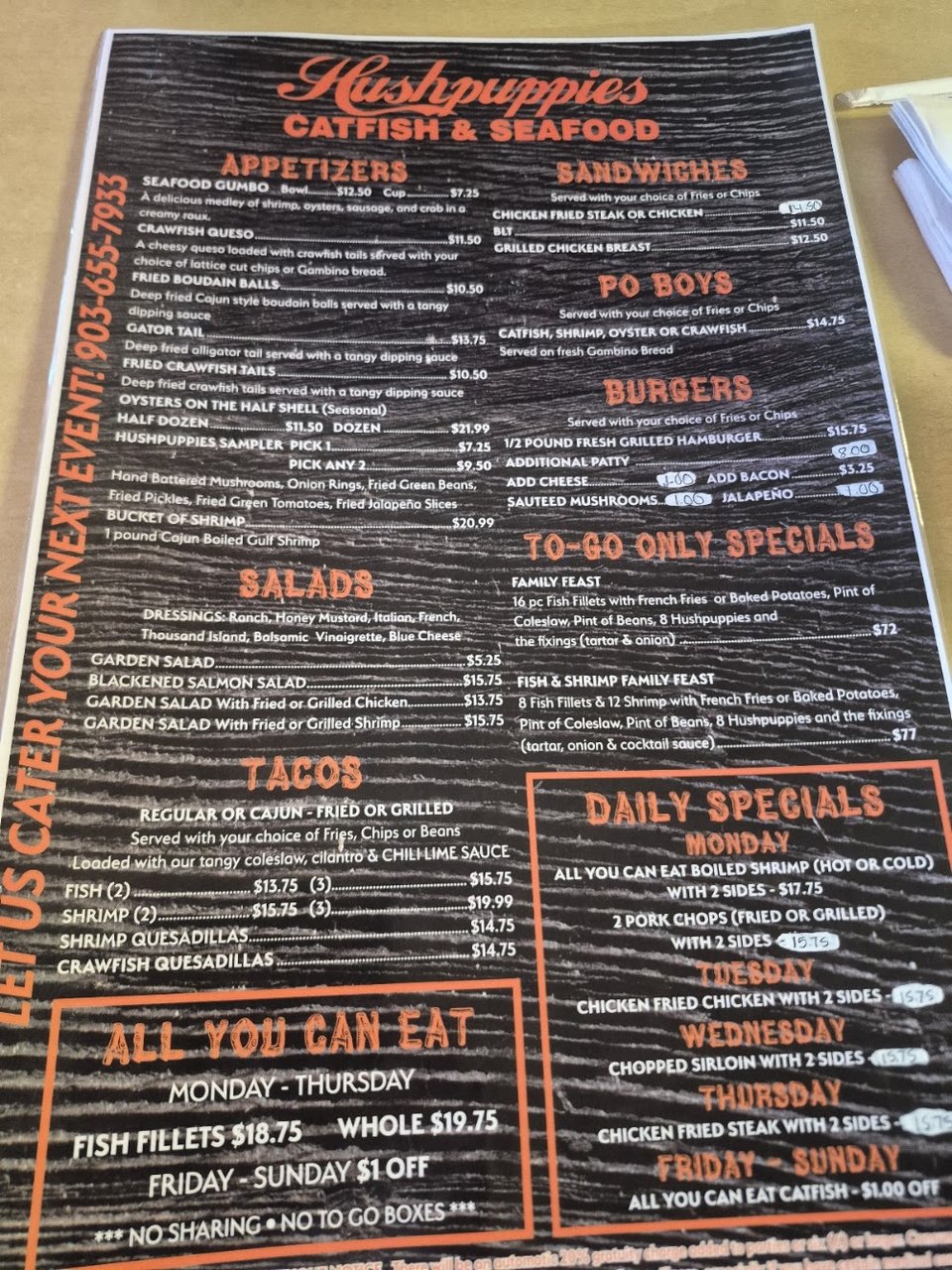 Printed menu showing catfish, gumbo, and burgers.